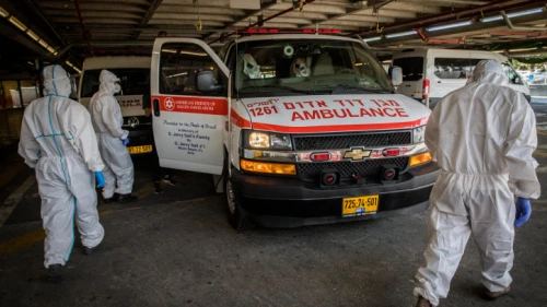Magen David Adom workers wear protective clothing outside of the coronavirus unit at Shaare Zedek Medical Center in Jerusalem on Sept. 14, 2020. Photo by Nati Shohat/Flash90.