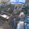 Materiel found by Israeli forces in the Gaza Strip, next to an Israeli flag. Credit: IDF Spokesperson's Unit.