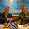 Israel Defense Ministry Director General Maj. Gen. (res.) Amir Baram (left) shakes hands with his Greek counterpart, Maj. Gen. Ioannis Bouras, after signing an approximately €3 billion ($3.5 billion) defense export agreement at Defense Ministry headquarters in Tel Aviv, Aug. 31, 2026. Photo: Israel Defense Ministry.