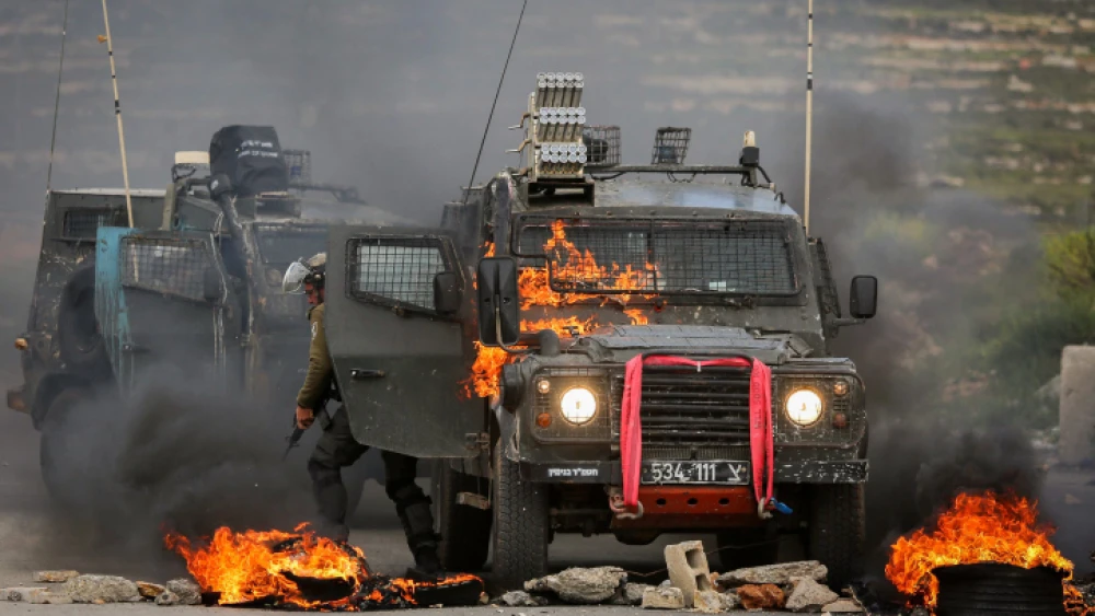 Israeli Border Police officers during clashes with Palestinian demonstrators near the town of Beit El in Judea and Samaria, March 27, 2019. Photo by Flash90.
