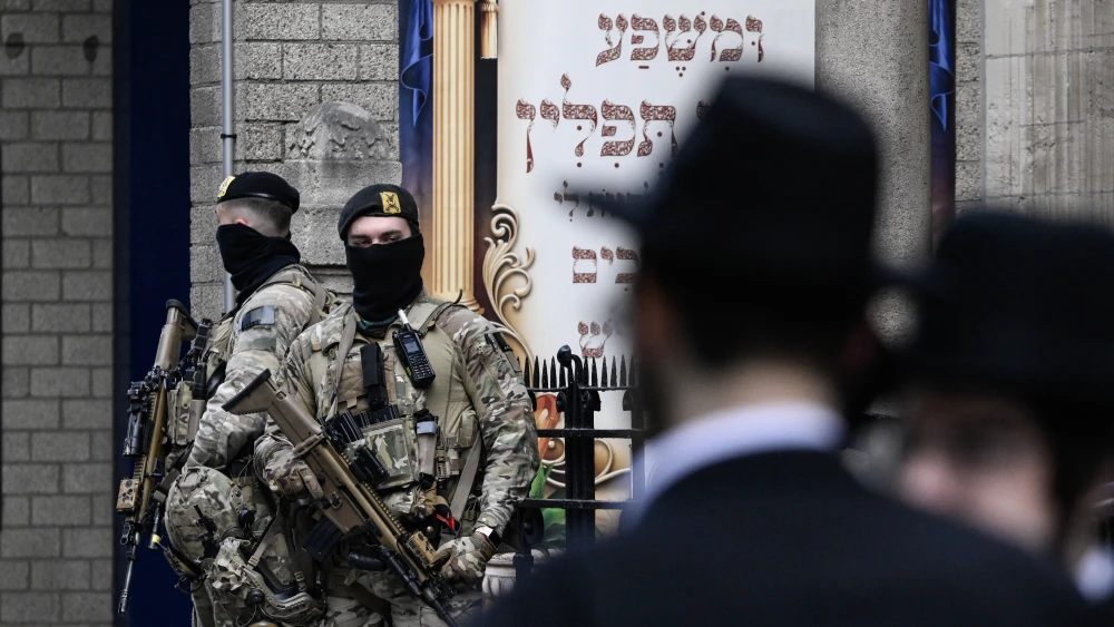 Belgian soldiers guarded an Antwerp synagogue March 23, 2026, following a car fire in the city's Jewish quarter and a recent synagogue explosion in Liege amid heightened security linked to the U.S.-Israeli war on Iran. Photo by John Thys/AFP via Getty Images.