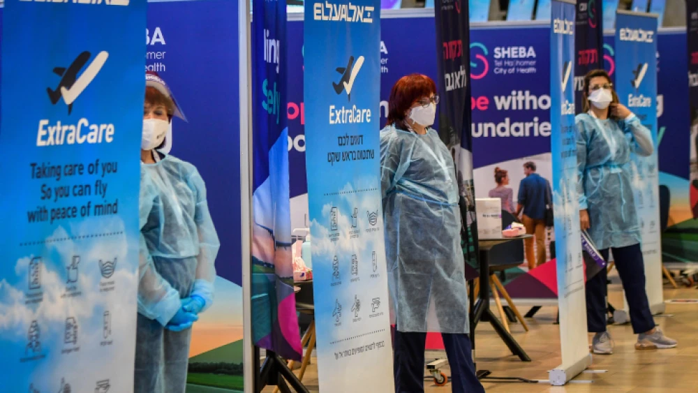 Medical technicians test passengers for COVID-19 at Ben-Gurion International Airport on March 8, 2021. Photo by Avshalom Sassoni/Flash90.