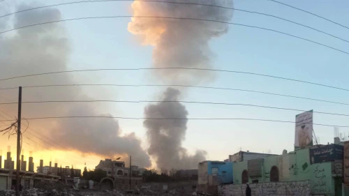 Smoke billows from the site of an airstrike in Sanaa, Yemen. Photo by Ibrahem Qasima via Wikimedia Commons.