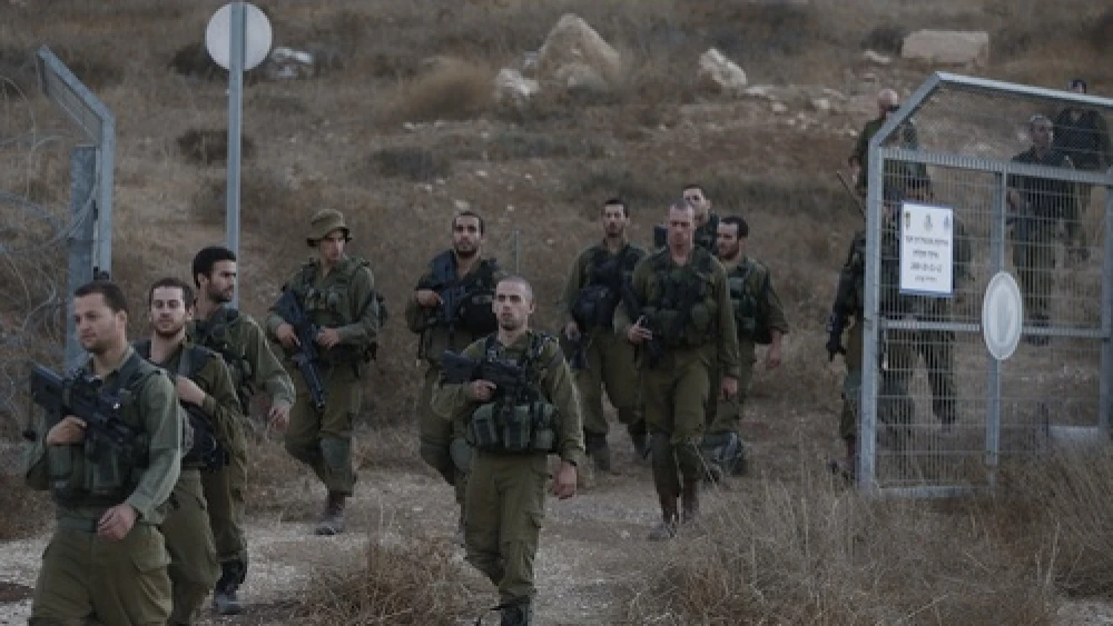 Click photo to download. Caption: Israeli soldiers are seen after searching for the remains of a drone in the Negev southern Israel on Oct. 6, 2012. Israeli jets scrambled to intercept a drone that crossed into Israeli airspace from the Mediterranean Sea, bringing it down without incident in the south of the country. Credit: Tsafrir Abayov/Flash90
