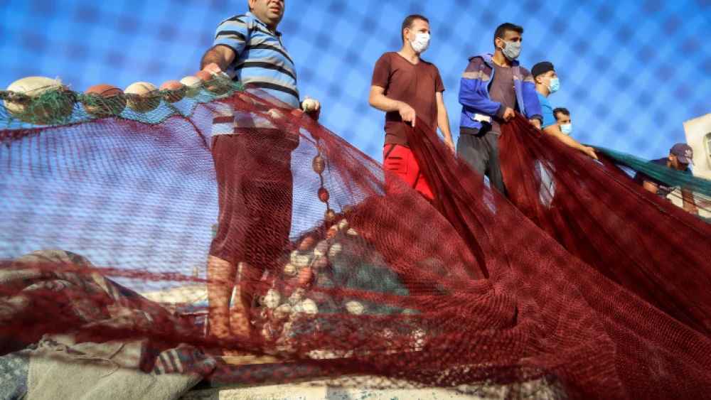 Palestinian fishermen prepare their nets in Rafah in the southern Gaza Strip on Sept. 2, 2020. Photo by Abed Rahim Khatib/Flash90.