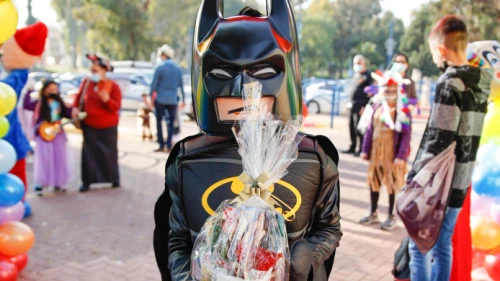 Kids dressed up in costumes arrive at their school ahead of the Jewish holiday of Purim in Sderot, southern Israel on Feb. 24, 2021. Photo by Flash90.