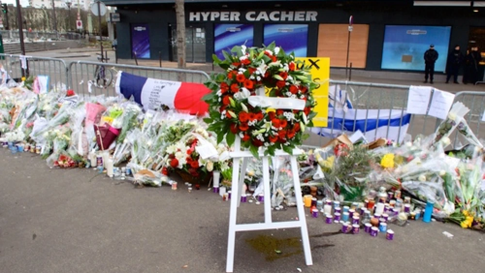 A wreath of flowers stands outside the Hyper Cacher kosher market in Paris on Jan. 16, 2015, a week after the Islamist terror attack there that killed four Jewish shoppers. Credit: U.S. Department of State.