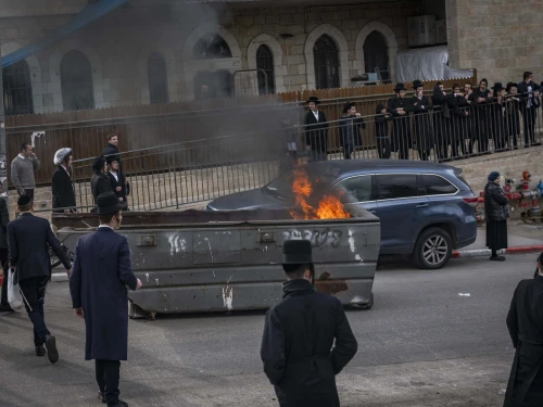 Ultra-Orthodox Jews block a road and clash with police during a protest against the autopsy of infants who died at an unlicensed daycare in Jerusalem, Jan. 20, 2026. Photo by Chaim Goldberg/Flash90.