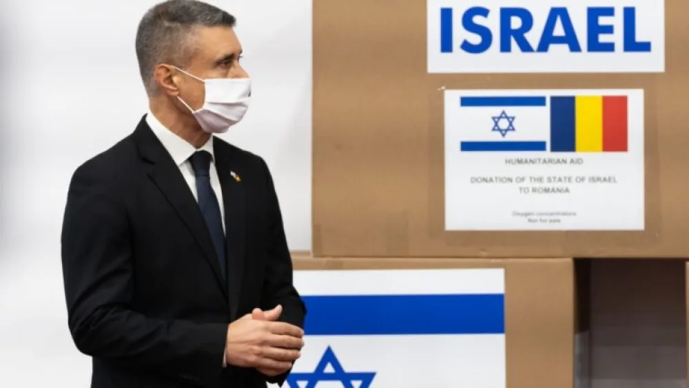 David Saranga, Israel's ambassador to Romania, with boxes of oxygen concentrators donated by the embassy along with AFI Europe Romania and Elbit Systems Israel. Photo courtesy of the Israeli embassy in Bucharest.