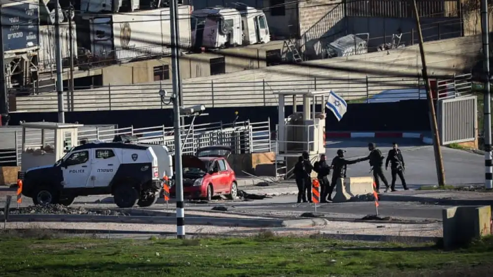 Security personnel at the scene of a Palestinian car-ramming attack near Hebron in Judea, Dec. 30, 2023. Photo by Wisam Hashlamoun/Flash90.