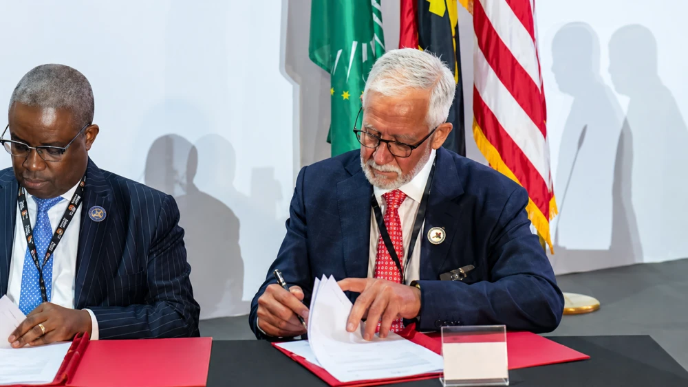 Haim Taib and Armando Manuel, chairman of Angola’s Sovereign Wealth Fund, at the signing of a $1 billion Lobito Corridor development initiative during the U.S.-Africa Business Summit in Luanda, Angola, in June 2025. Credit: Mitrelli.