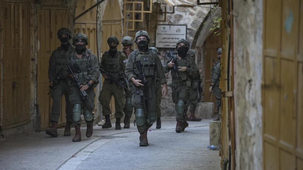Israel Defense Forces soldiers patrol an alleyway in the Old City of Hebron, in Judea, on Sept. 5, 2026. Photo by Mosab Shawer/Middle East Images/AFP via Getty Images.