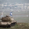 An old Israeli tank with a flag overlooking the Syrian town of Quneitra in the Golan Heights on Feb. 11, 2018. Photo by Hadas Parush/Flash90.