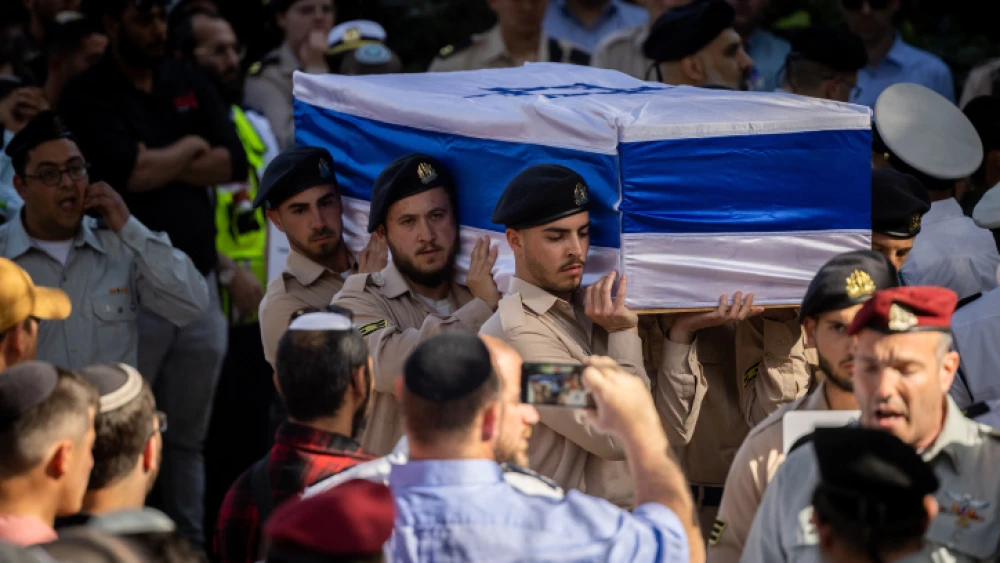 Friends and family attend the funeral of the Yaniv brothers Hallel, 21, and Yagel, 19, at the Mount Herzl military cemetery in Jerusalem. Photo by Yonatan Sindel/Flash90.