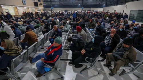 Palestinian workers at the Erez border crossing in Beit Hanun in the northern Gaza Strip as they wait to enter Israel, March 13, 2022. Photo by Attia Muhammed/Flash90.