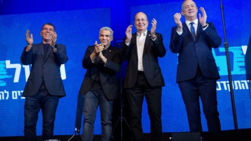 Blue and White Party leader Benny Gantz (far right) with party co-leaders Moshe Ya'alon (second from right), Yair Lapid (second from left) and Gabi Ashkenazi, at party headquarters in Tel Aviv, on election night, March 3, 2020. Photo by Miriam Alster/Flash90.