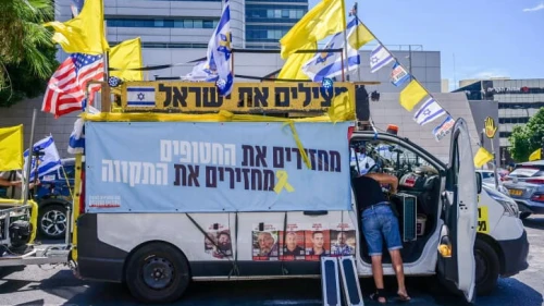 Relatives and supporters of Israelis held hostage by Hamas terrorists in Gaza prepare to leave in a convoy from Tel Aviv toward the Gaza Strip, Aug. 28, 2024. Photo by Avshalom Sassoni/Flash90.