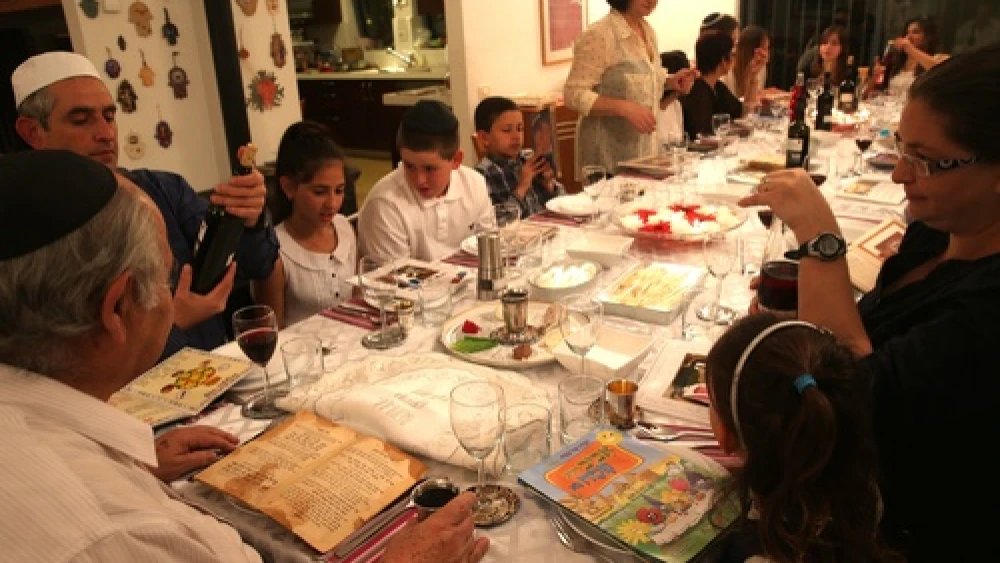 A family seen during the Passover seder on the first night of the holiday in Tzur Hadassah, Israel, on March 25, 2013. Photo by Nati Shohat/Flash 90.