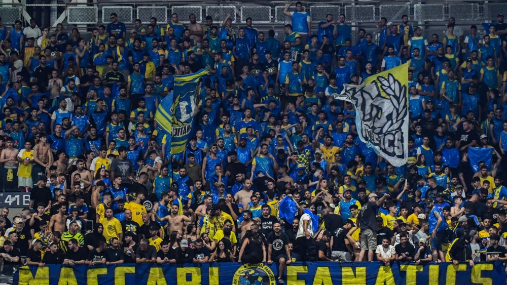 Maccabi Tel Aviv fans attend an Israeli Premier League match against Maccabi Haifa at Sammy Ofer Stadium in Haifa on May 19, 2025. Credit: Flash90.
