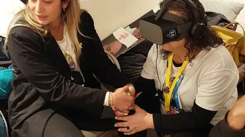 Hamas hostage Shlomi’s Ziv's mother Rozita views "Shlomi's Glasses" for the first time, together with her neice, Liat Ariel, who created the 8-minute virtual reality experience. Photo courtesy of Liat Ariel.