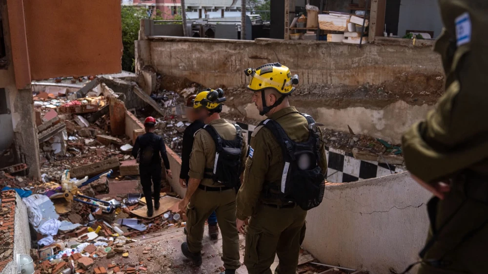 Personnel from an IDF delegation are seen walking through the rubble in Venezuela in 2026. Credit: IDF.