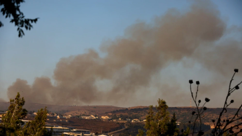 Smoke rises from a fire caused from a rocket fired from Lebanon by Hezbollah, near Moshav Avivim in northern Israel, Sept. 1, 2019. Photo by David Cohen/Flash90.