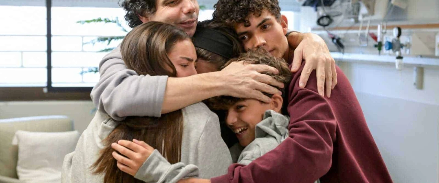 Ofer Kalderon reunites with his children Rotem, Gaya, Erez and Sahar on Feb. 1, 2025. Erez and Sahar, who were also abducted on Oct. 7, 2023, were released in November 2023. Photo by Maayan Toaf/GPO.