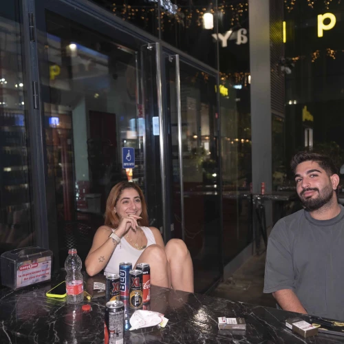 Noam Swissa (left) and Asif Korliker sit outside their hotel in Tel Aviv on Sept. 7, 2024. Photo by Canaan Lidor.