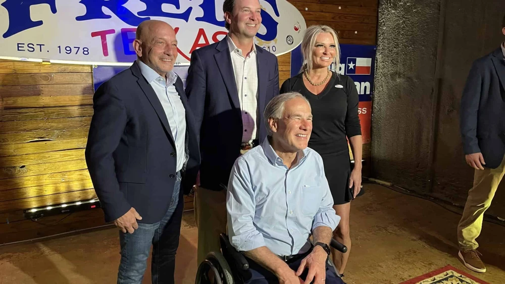 Texas Gov. Greg Abbott (seated) with congressional candidate Craig Goldman (rear, center) in Fort Worth, May 21, 2024. Credit: Greg Abbott/X.