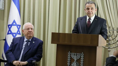 Israeli President Reuven Rivlin (left) looks on as incoming Turkish Ambassador to Israel Kemal Okem speaks during a ceremony for new ambassadors at the President's Residence in Jerusalem Dec. 12, 2016. Credit: Isaac Harari/Flash90.