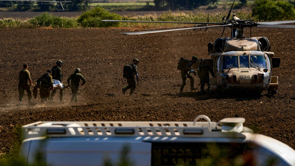 Israel Defense Forces troops evacuate people who were wounded by a rocket fired from Lebanon near the Jewish state's northern border, Oct. 22, 2024. Photo by Ayal Margolin/Flash90.