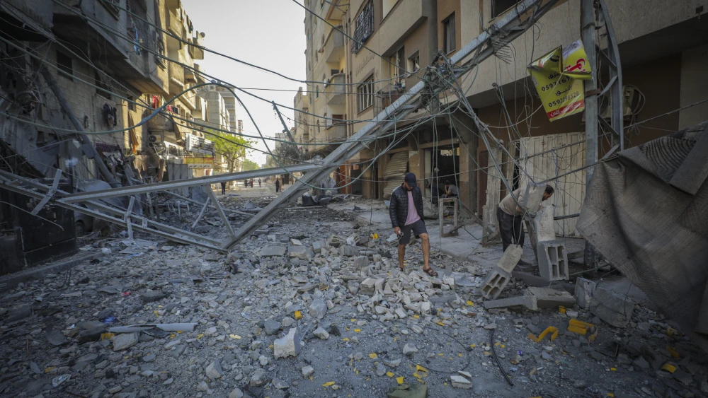 Palestinians inspect the damage to their homes following an Israeli airstrike on the Nuseirat refugee camp in the central Gaza Strip, on May 23, 2026. Photo by Ali Hassan/Flash90.