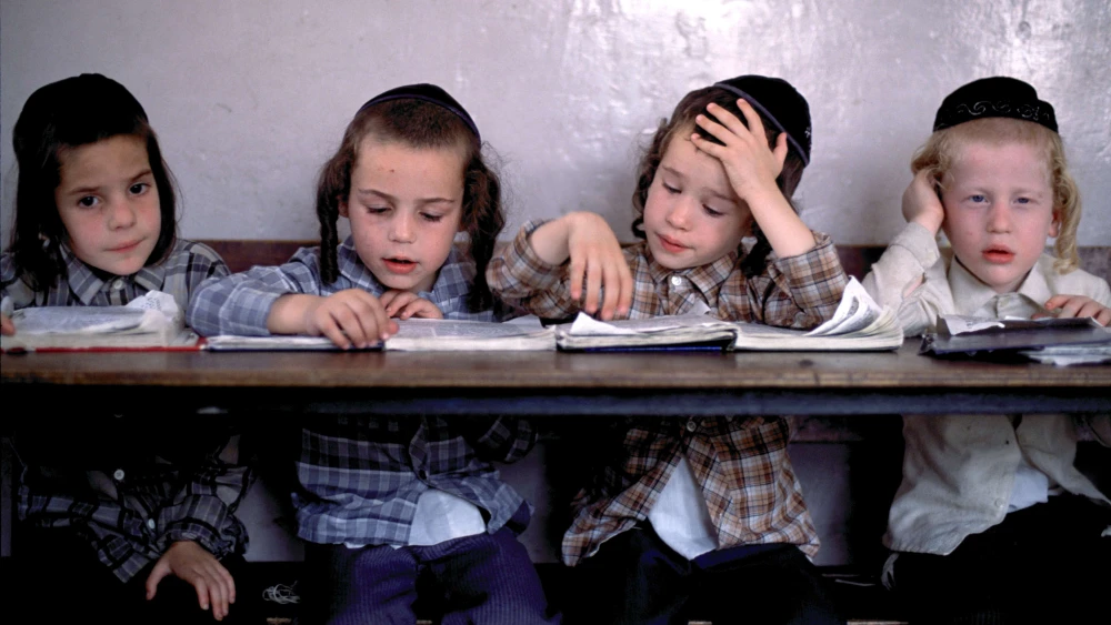 Orthodox Jewish boys study the Torah at a religious school in Jerusalem. Photo by Tom Stoddart/Getty Images.