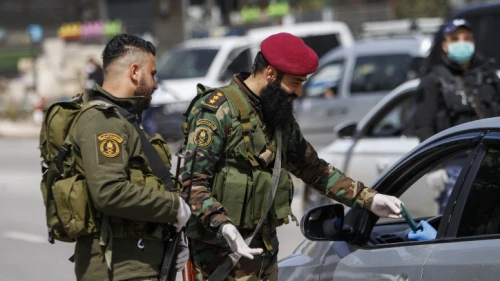 Palestinian security personnel block the entrance to the Samarian city of Nablus (Shechem), March 23, 2020. Photo by Nasser Ishtayeh/Flash90.