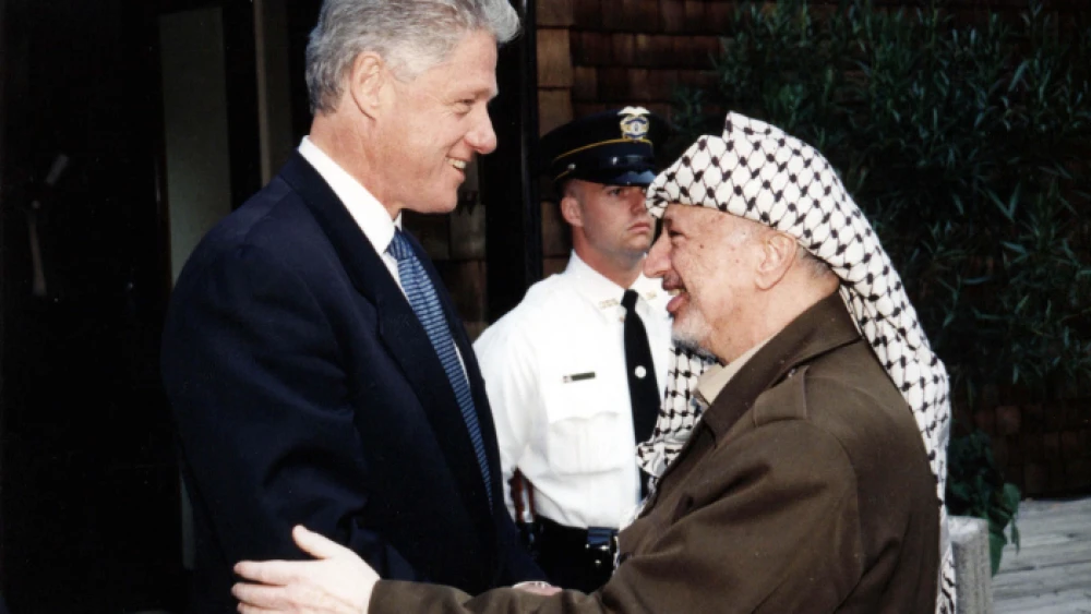 U.S. President Bill Clinton with PLO Chairman Yasser Arafat. Photo by Palestinian Authority via Abed Al Rahim Al Khatib/Flash90.