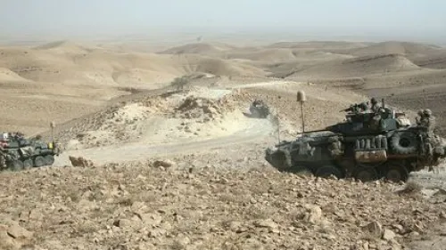 In July 2009, light-armored vehicles with U.S. Marine Corps' Task Force 3rd Light Armored Reconnaissance Battalion, Regimental Combat Team 8, traverse the rocky terrain of the Sinjar Mountains while deployed to the Nineveh province in Iraq. Credit: Sgt. Eric C. Schwartz via Wikimedia Commons.