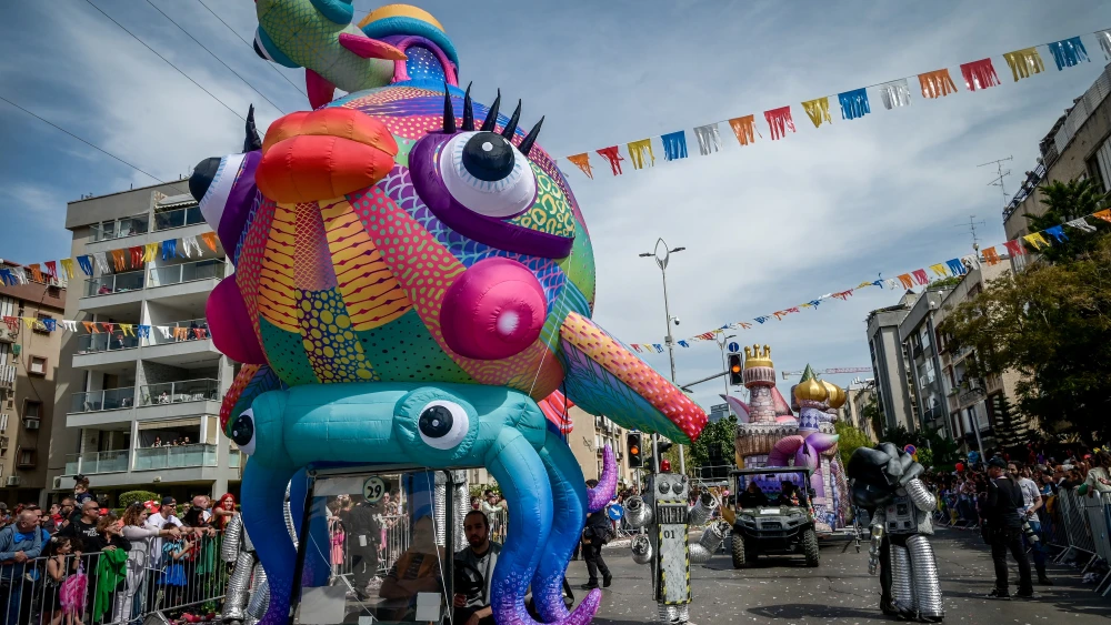Israelis enjoy a parade in the city of Holon during the Jewish holiday of Purim on March 7, 2023. Photo by Avshalom Sassoni/Flash90.