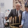 Blue and White Party chairman and Knesset member Benny Gantz lights a memorial candle with his sons during a Holocaust Remembrance Day ceremony at the Knesset in Jerusalem, May 2, 2019. Photo by Hadas Parush/Flash90.
