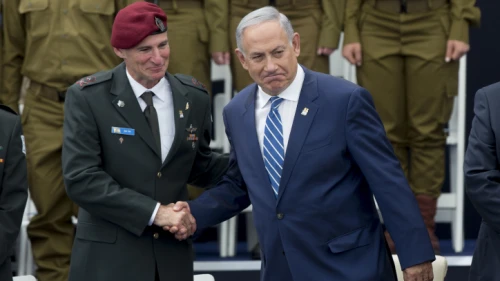 Israeli Prime Minister Benjamin Netanyahu shakes hands with Deputy IDF Chief of Staff Yair Golan (left) at a ceremony for outstanding soldiers as part of Israel's 68th Independence Day celebrations, at the President's residence in Jerusalem. May 12, 2016. Photo by Yonatan Sindel/Flash90.