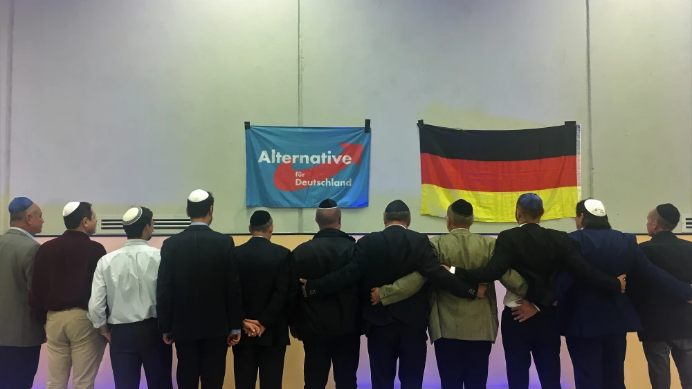 Members of the new Jewish factions for Germany's far-right AfD Party sing the traditional Jewish song "Oseh Shalom" on stage together. Credit: Orit Arfa.