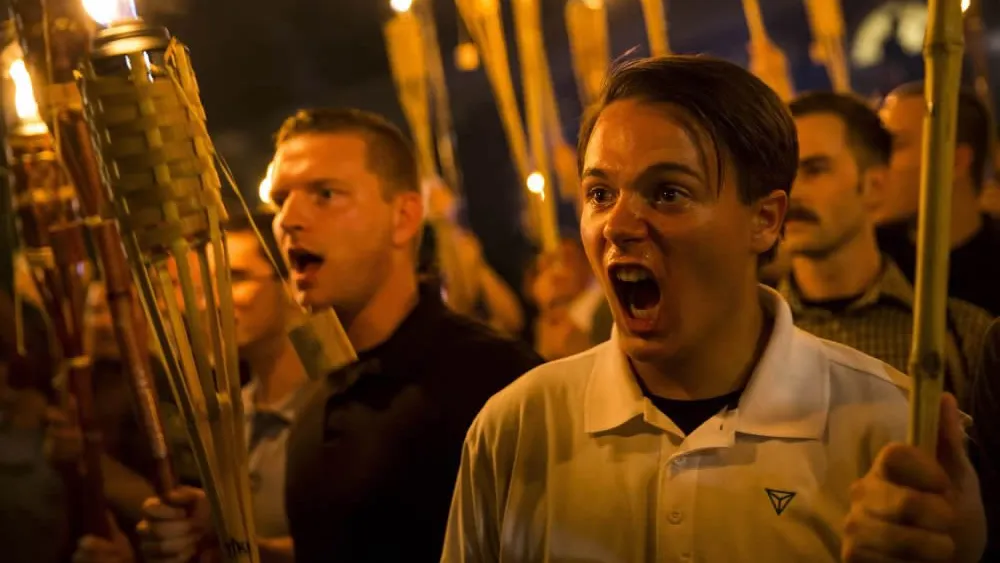 Torch-carrying protesters in Charlottesville march chanting anti-Semitic and anti-minority slogans on Aug. 11, 2017. Source: Twitter.