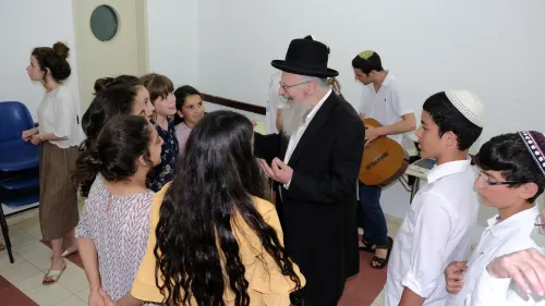 Tzfat Chief Rabbi Shmuel Eliyahu enjoys pre-Shabbat activities at the OneFamily Sleepaway camp in northern Israel in July 2019. Photo by Eytan Morgenstern.