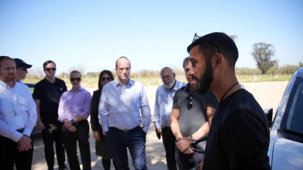 Nova music festival survivor Asaf Aharon shares his story at Nova with mission participants. Credit: Courtesy of the Orthodox Union.