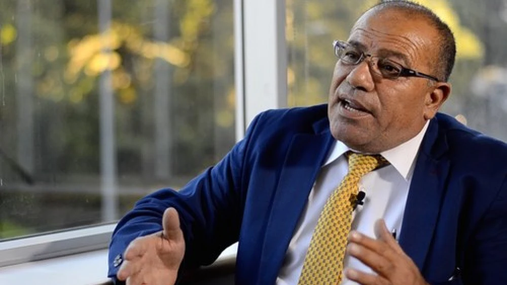 Click photo to download. Caption: Palestinian human rights activist Bassem Eid. Credit: YouTube.