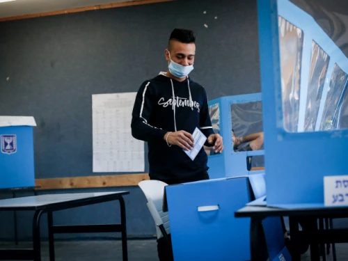 Arab Israelis cast their ballots as they vote in Israel's general election, in Kafr Manda in northern Israel, on March 23, 2021. Photo by Jamal Awad/Flash90.