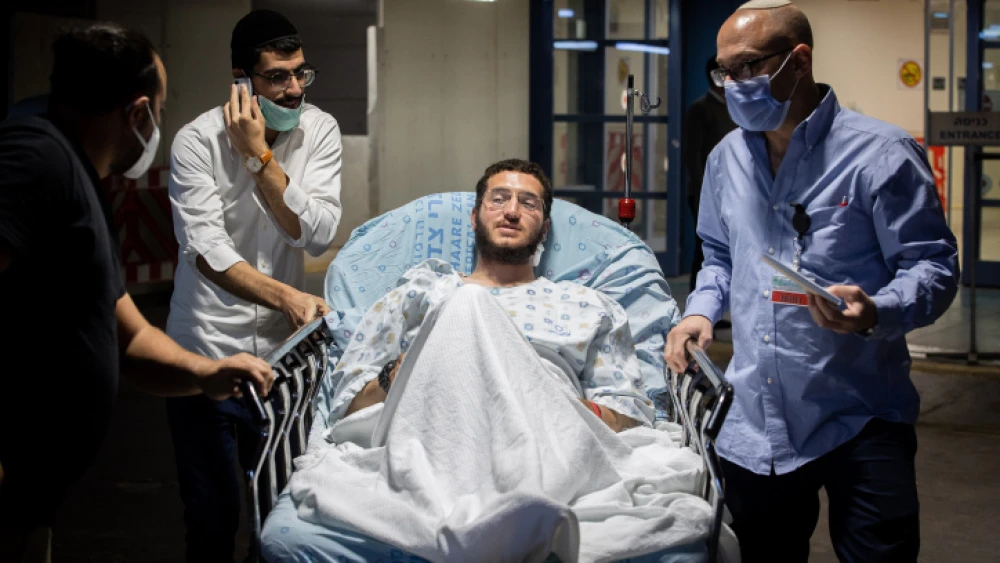 Avraham Elmaleh, who was wounded in a terrorist attack earlier in the day, prepares to give a statement to the media outside the emergency room at the Shaare Zedek Medical Center in Jerusalem on Dec. 4, 2021. Photo by Yonatan Sindel/Flash90.