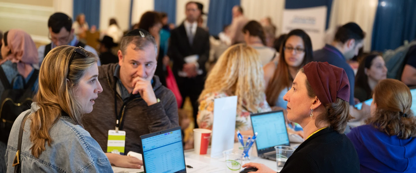 Prospective immigrants receive assistance at an Aliyah-in-One event. Photo by Nir Arieli.
