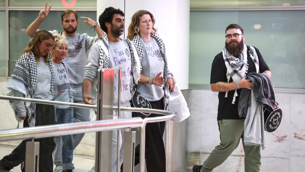 Members of a Gaza-bound flotilla, that were detained by Israeli security forces last week, react as they prepare to be greeted by family and friends after arriving at Sydney International Airport on May 25, 2026. Photo by David Gray / AFP via Getty Images.