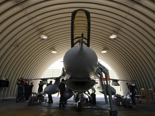 Israeli soldiers prepare an F-16 jet