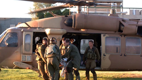 IDF soldiers rush injured Israelis to Soroka Hospital in Beersheva after evacuating them by helicopter on Aug. 26, 2014, following a mortar attack on Kibbutz Nirim near the Gaza border. Two Israeli men died from wounds they sustained in the incident, which took place shortly before the latest Israel-Hamas ceasefire deal went into effect. Photo by Flash90.
